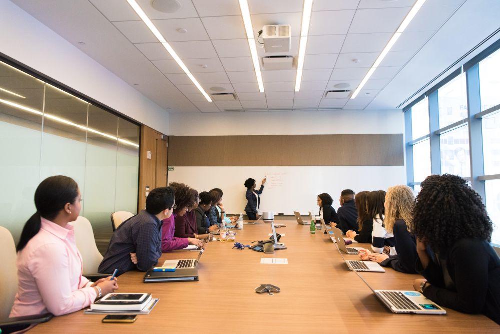 professionals sit in a conference room