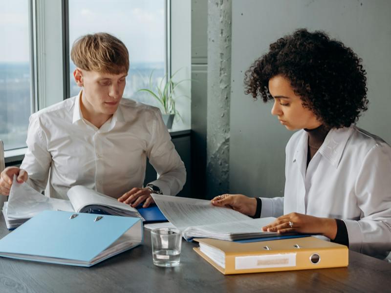 A woman and man studying to become an Enrolled Agent